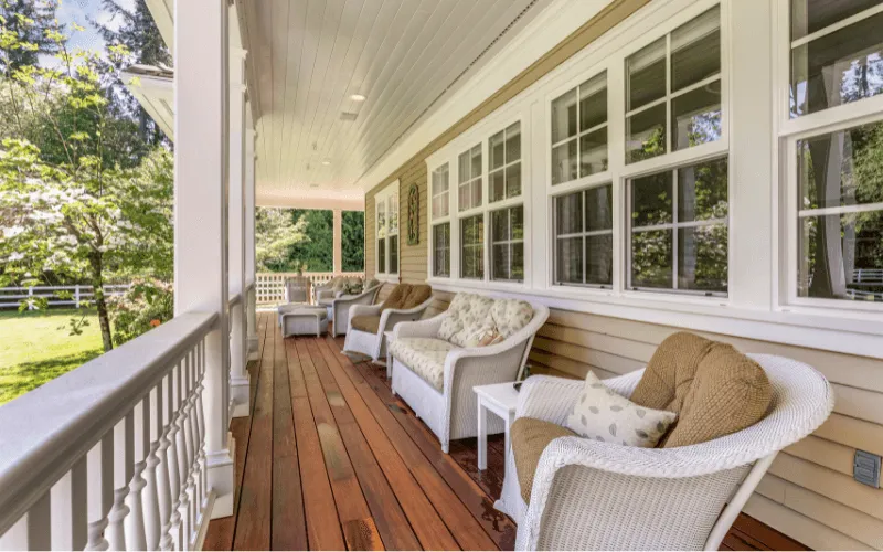 classic-long-southern-style-wood-stained-deck-white-ballusters-columns_result